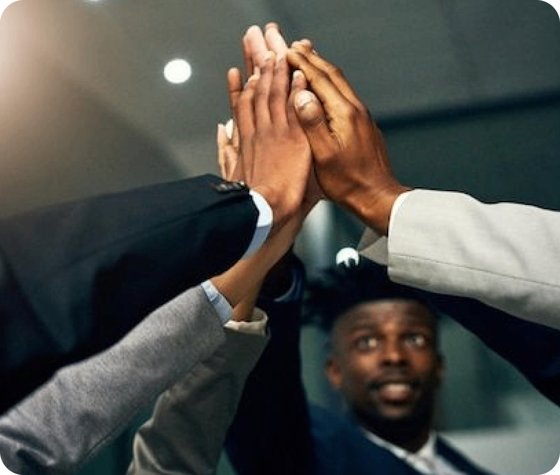 Team collaboration showing hands coming together in unity